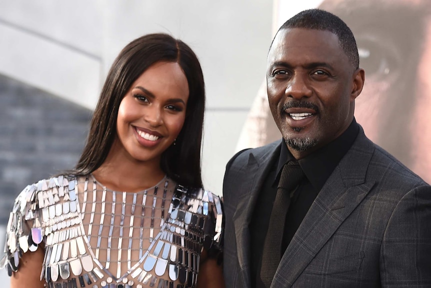 Idris Elba smiling with his wife Sabrina Dhowre Elba.