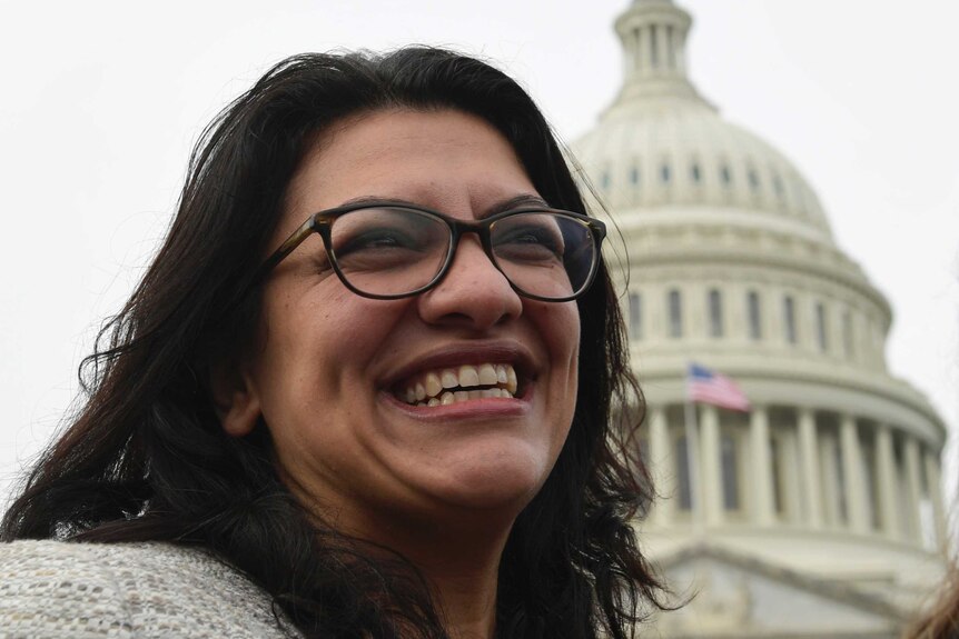 Rashida Tlaib smiles in Capitol Hill in Washington.