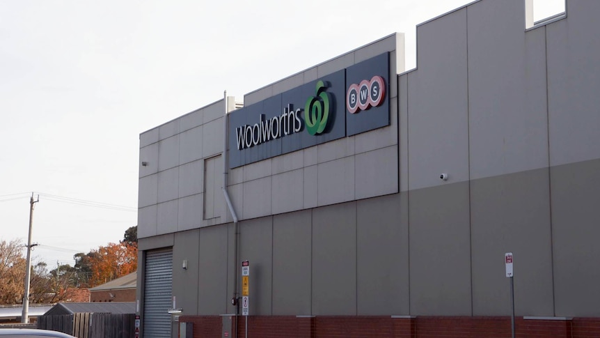 An image showing the side of a commercial office building, with a Woolworths sign at Mooroopna