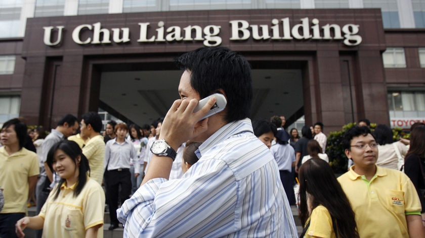 Workers evacuate buildings from as far away as Bangkok.