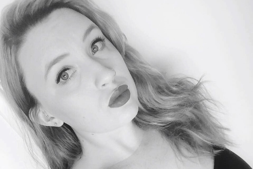 A black and white selfie of Olivia Mead.