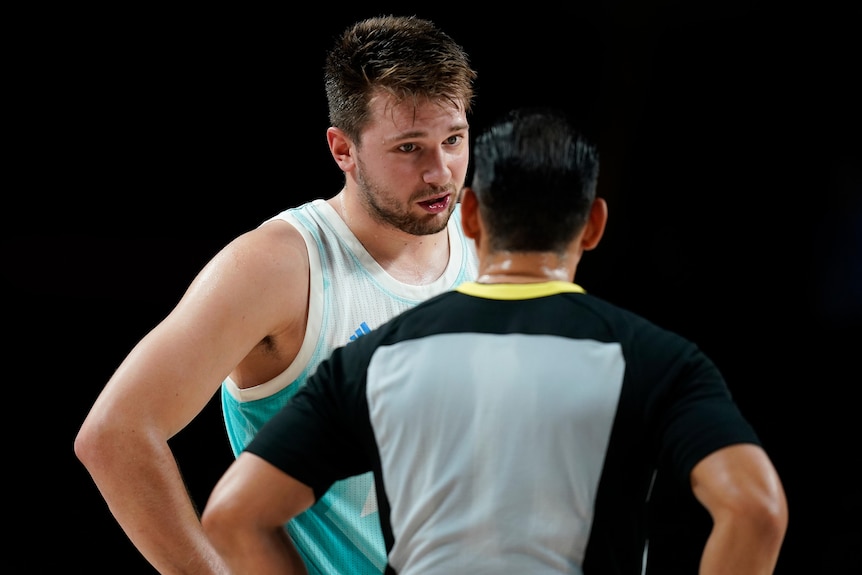Slovenian basketball player Luka Doncic talks to the ref during the bronze-medal game against Australia at the Tokyo Olympics.