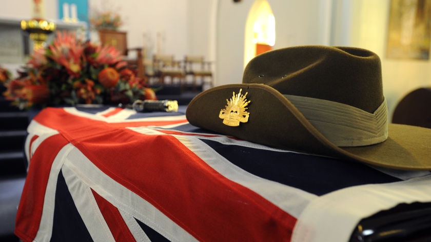 A slouch hat and the Australian flag