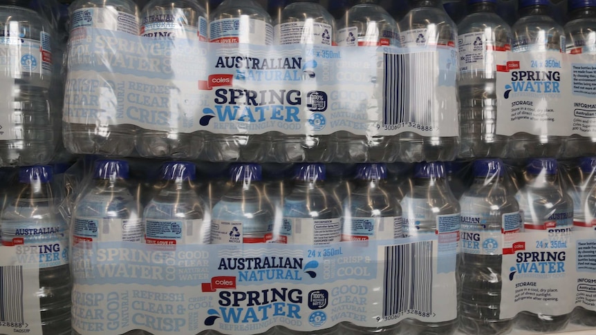 Large packs of coles bottled water.