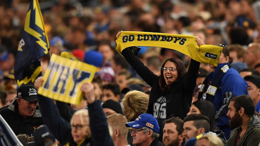 North Queensland Cowboys fans celebrate a try against Parramatta