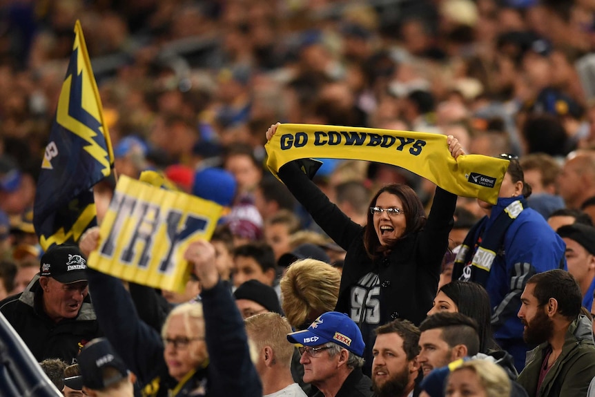 North Queensland Cowboys fans celebrate a try against Parramatta