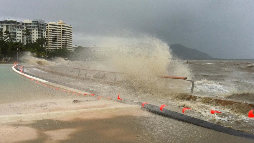 Waves crash over the lagoon on the Cairns esplanade after Cyclone Yasi hit on February 3, 2011.