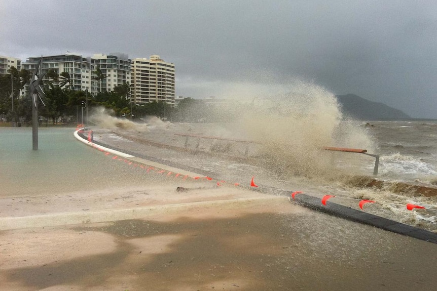 Waves crash over the lagoon on the Cairns esplanade after Cyclone Yasi hit on February 3, 2011.