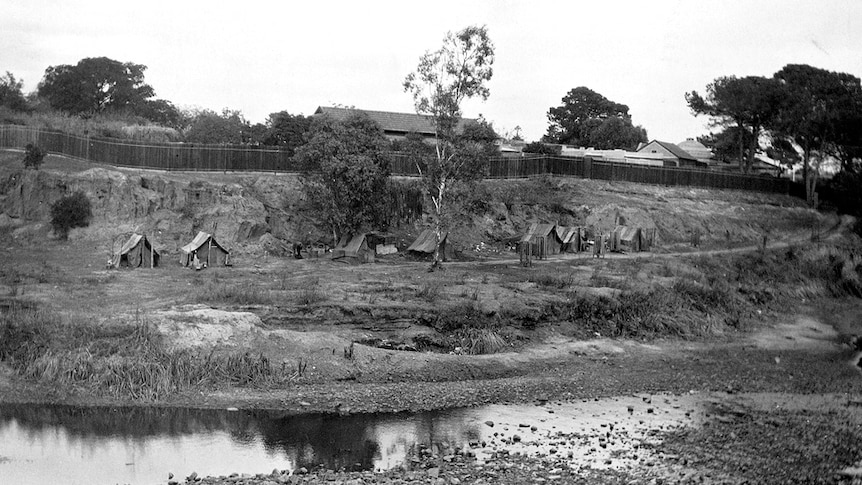 Huts owned by homeless people along the banks of the Torrens during the Depression