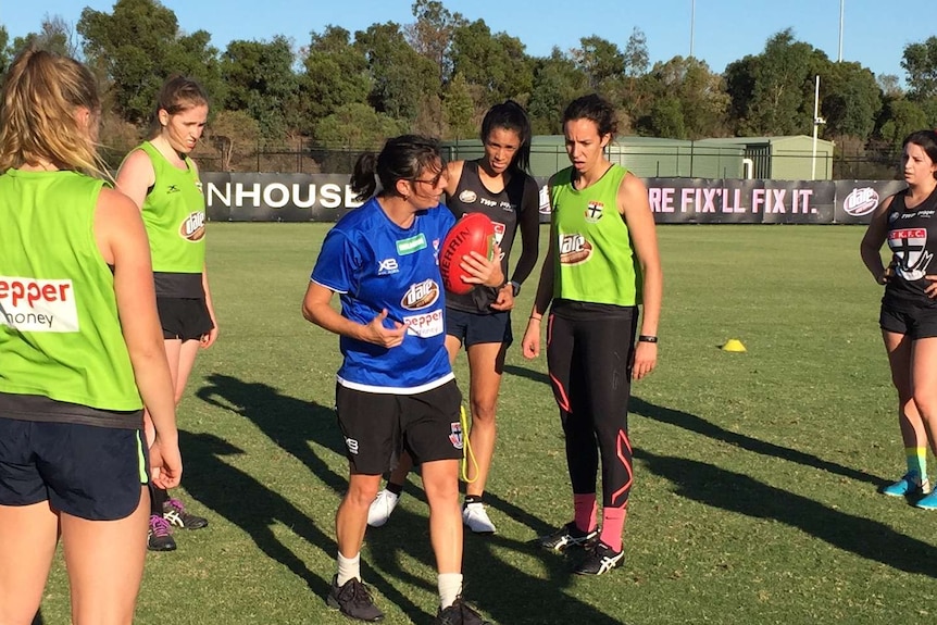 Southern Saints coach Peta Searle talks to players