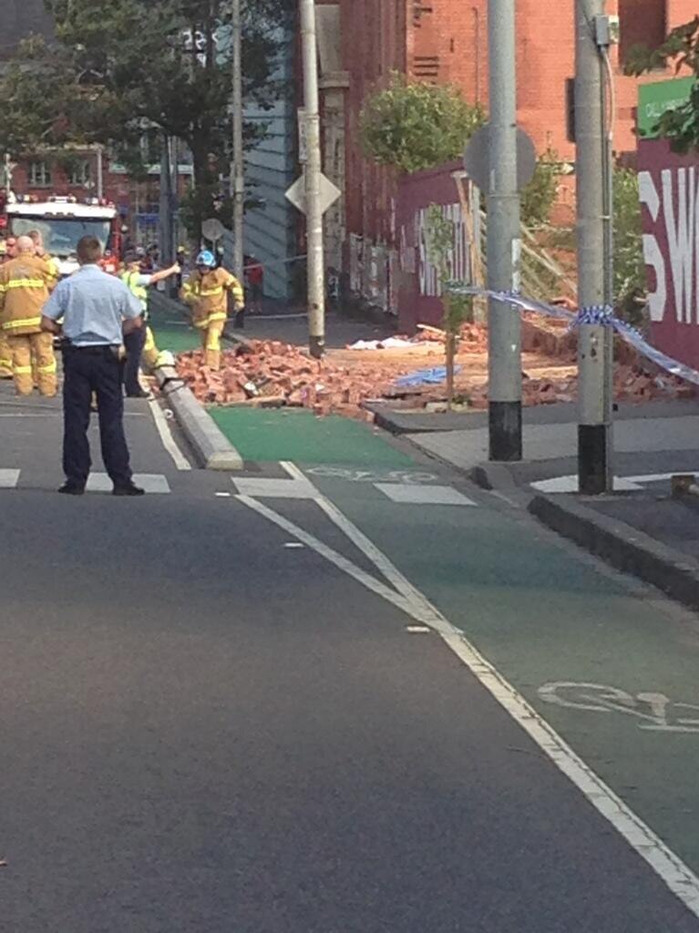 Authorities work at the scene of a fatal wall collapse in Melbourne