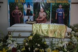 Photos of Ms Gonzalez adorn her white coffin
