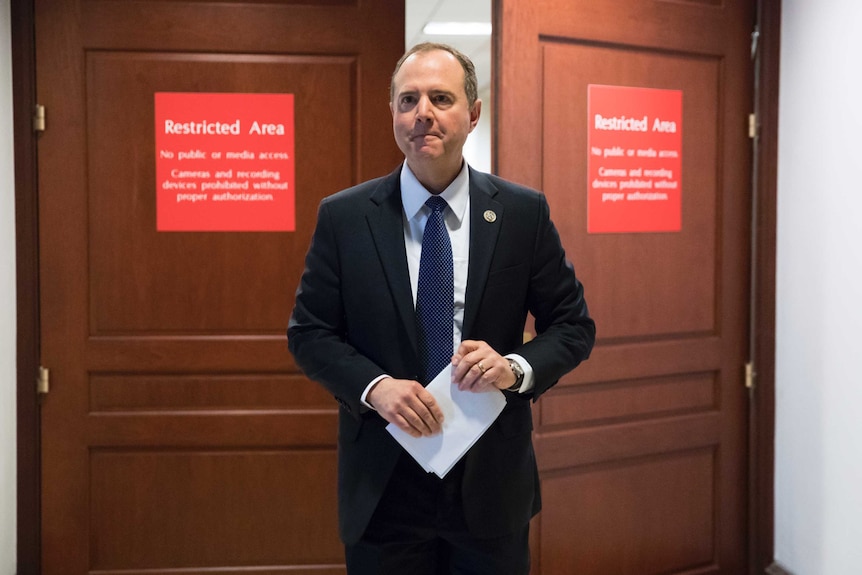 Adam Schiff leaves a secure area where the panel meets at the Capitol in Washington.