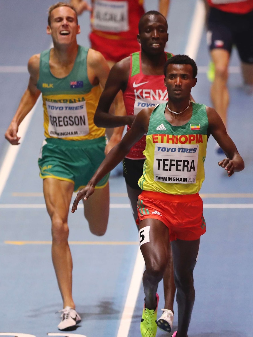 Ethiopia's Samuel Tefera, (front), beats Vincent Kibet and Ryan Gregson (L) in men's 1,500m semi.