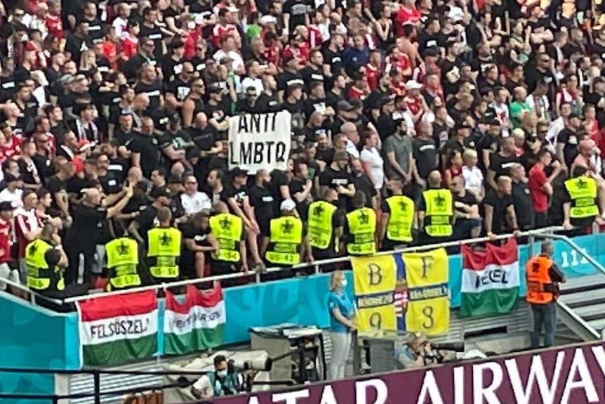 A banner with the message 'anti-LMBTQ' is shown in the crowd during a Euro 2020 game in Hungary.