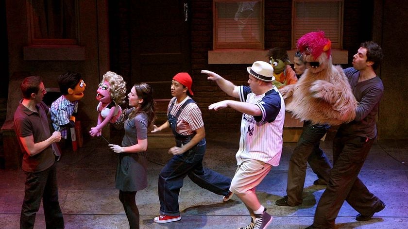 The cast of Avenue Q perform during a media call