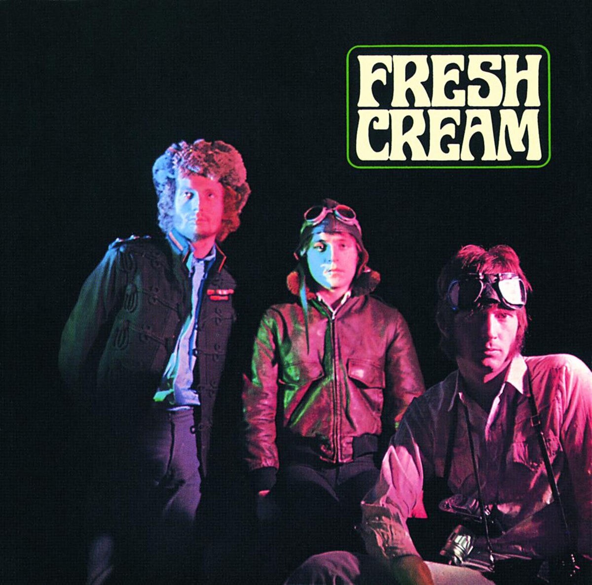 A photo of the members of Cream with psychedelic lighting