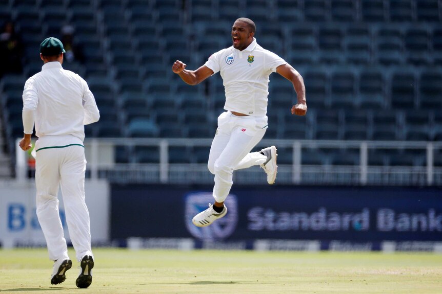 Vernon Philander jumps in the air in celebration.