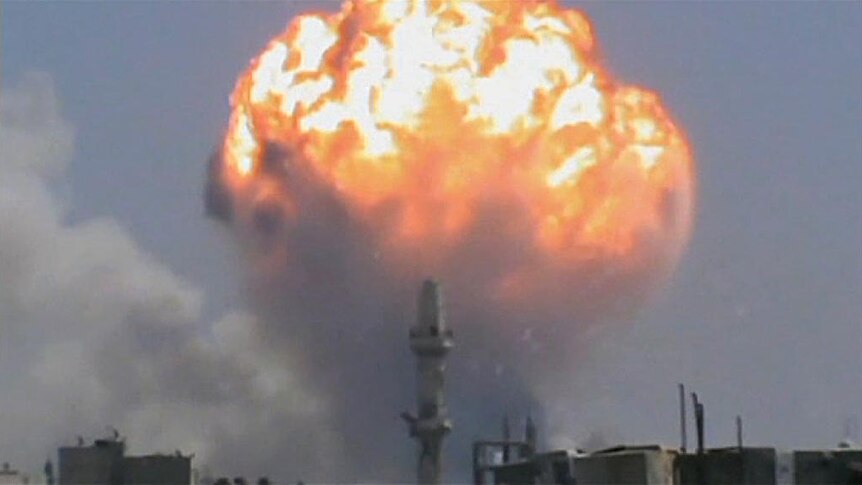 A fireball rises from the Homs ammunitions factory after the rocket attack.