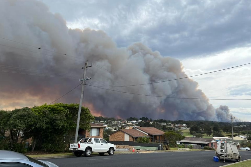 Smoke burning over homes