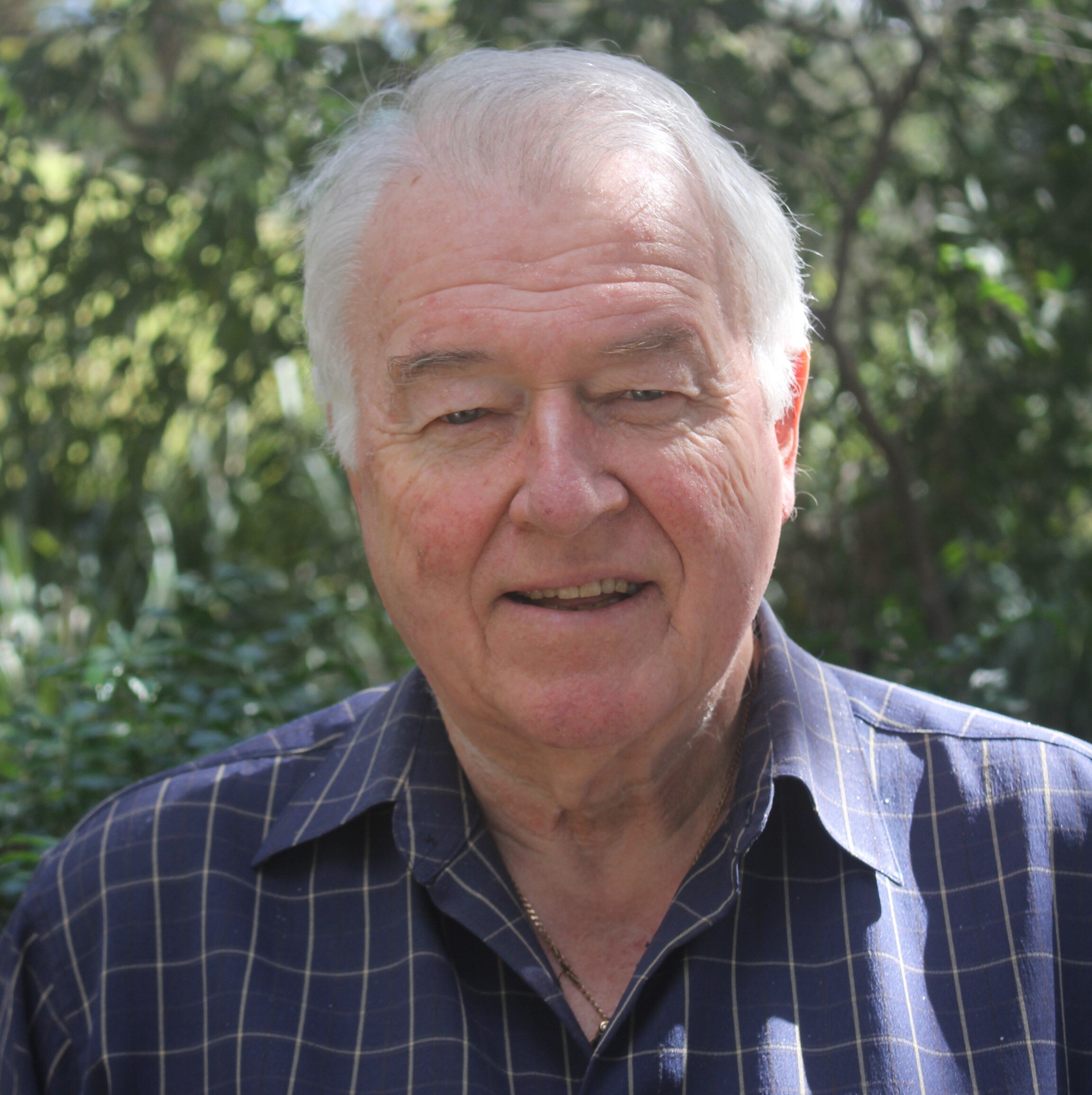 A man with a striped long shirt on.