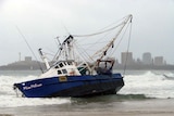 The trawler, Miss Melissa, sits stranded on Mooloolaba Beach