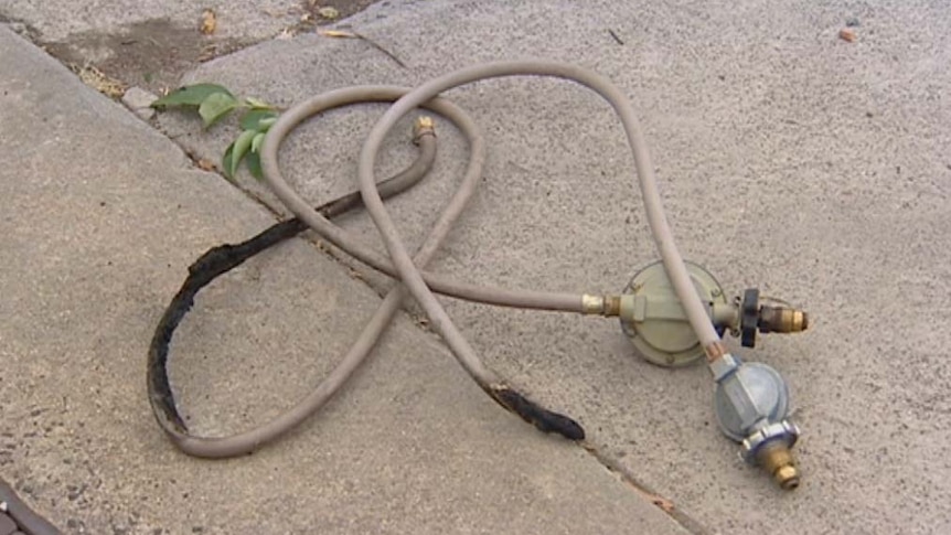A faulty gas bottle connection on the ground.
