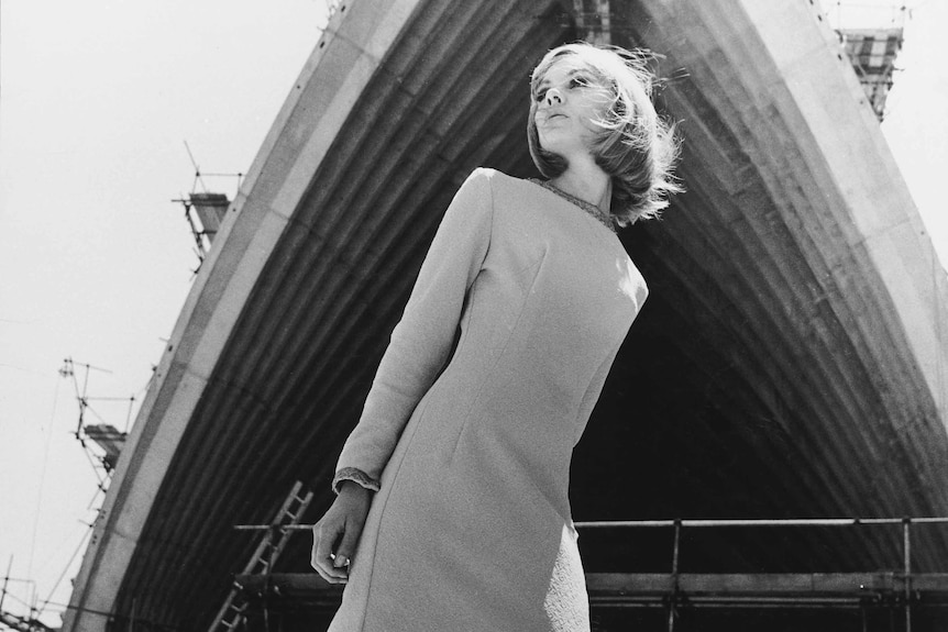 A woman outside the sydney opera house