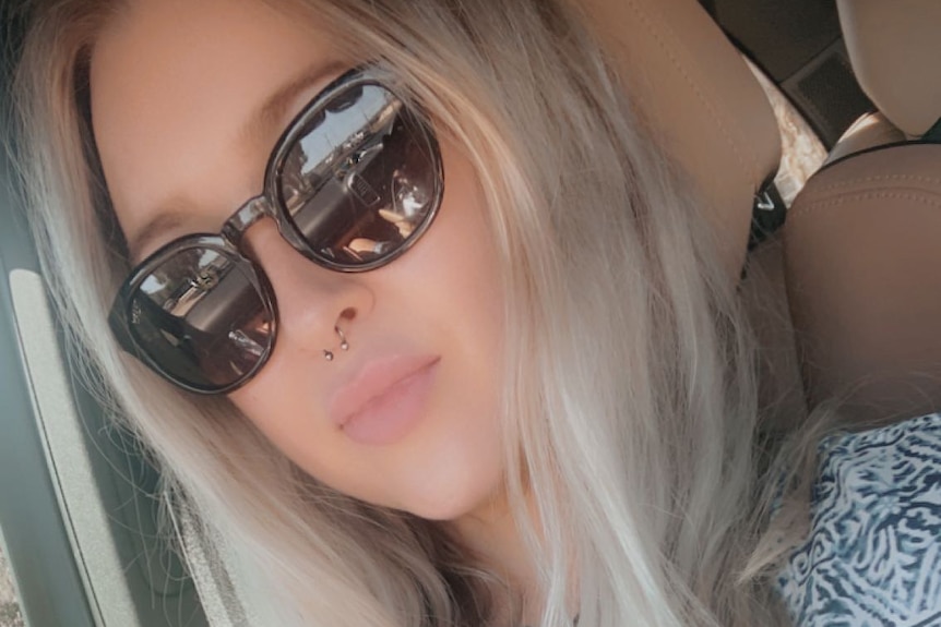 Chloe wearing sunnies in a car for sex detox story