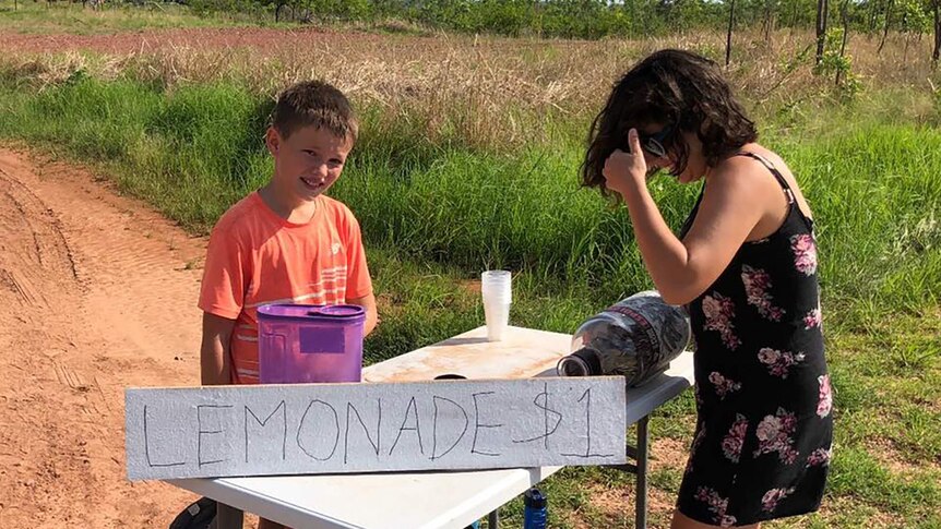 A photo of the Jazyschyn family at the lemonade stand.