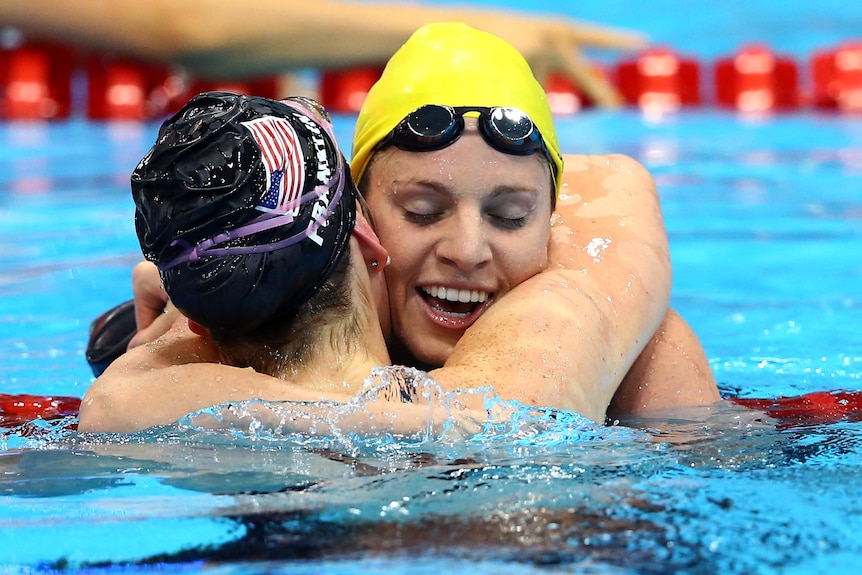 Emily Seebohm congratulates Missy Franklin after the women's 100m backstroke final.