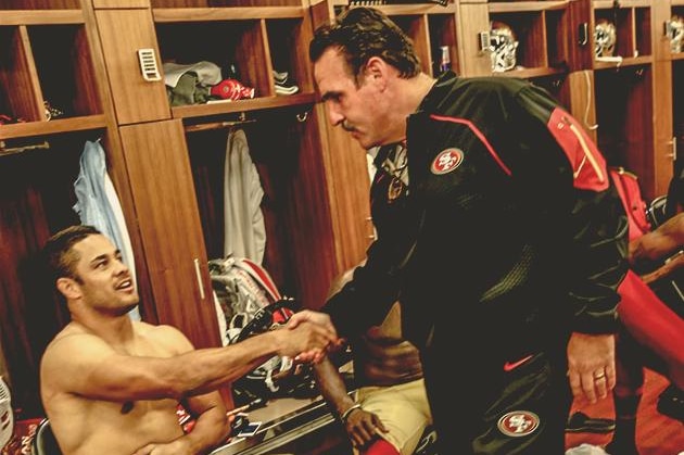 Jarryd Hayne shakes the hand of San Francisco 49ers coach Jim Tomsula.