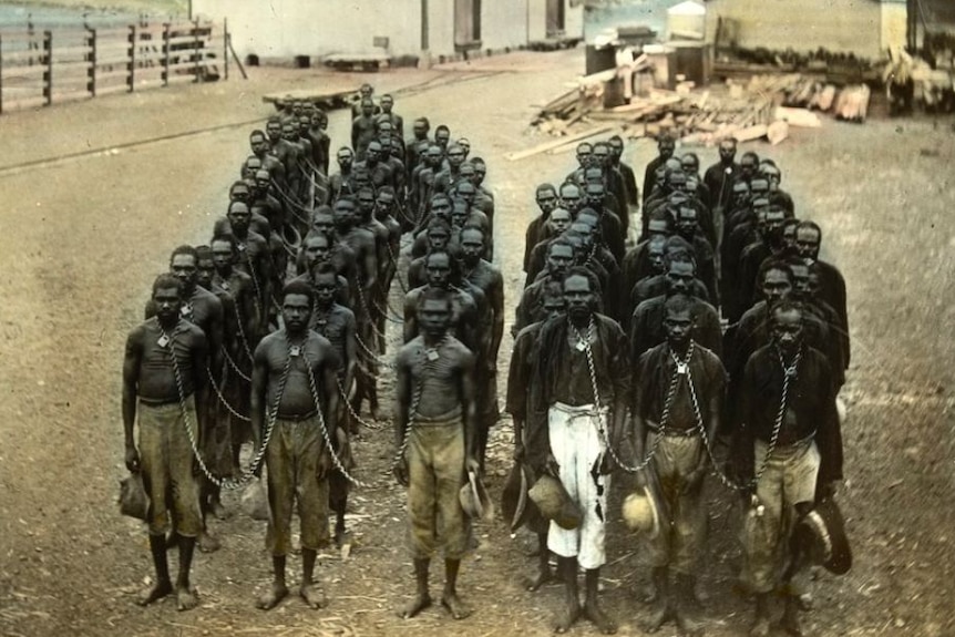 A group of Aboriginal people chained together near Wyndham, WA.