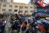 Iraqi Federal Police celebrate in the Old City.