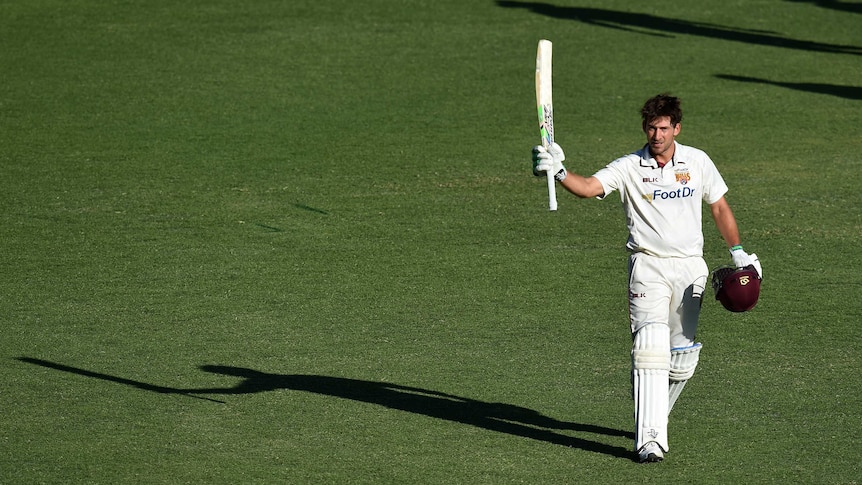 Joe Burns raises the bat after Sheffield Shield century