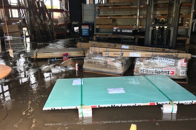 Pallets inundated with floodwaters.