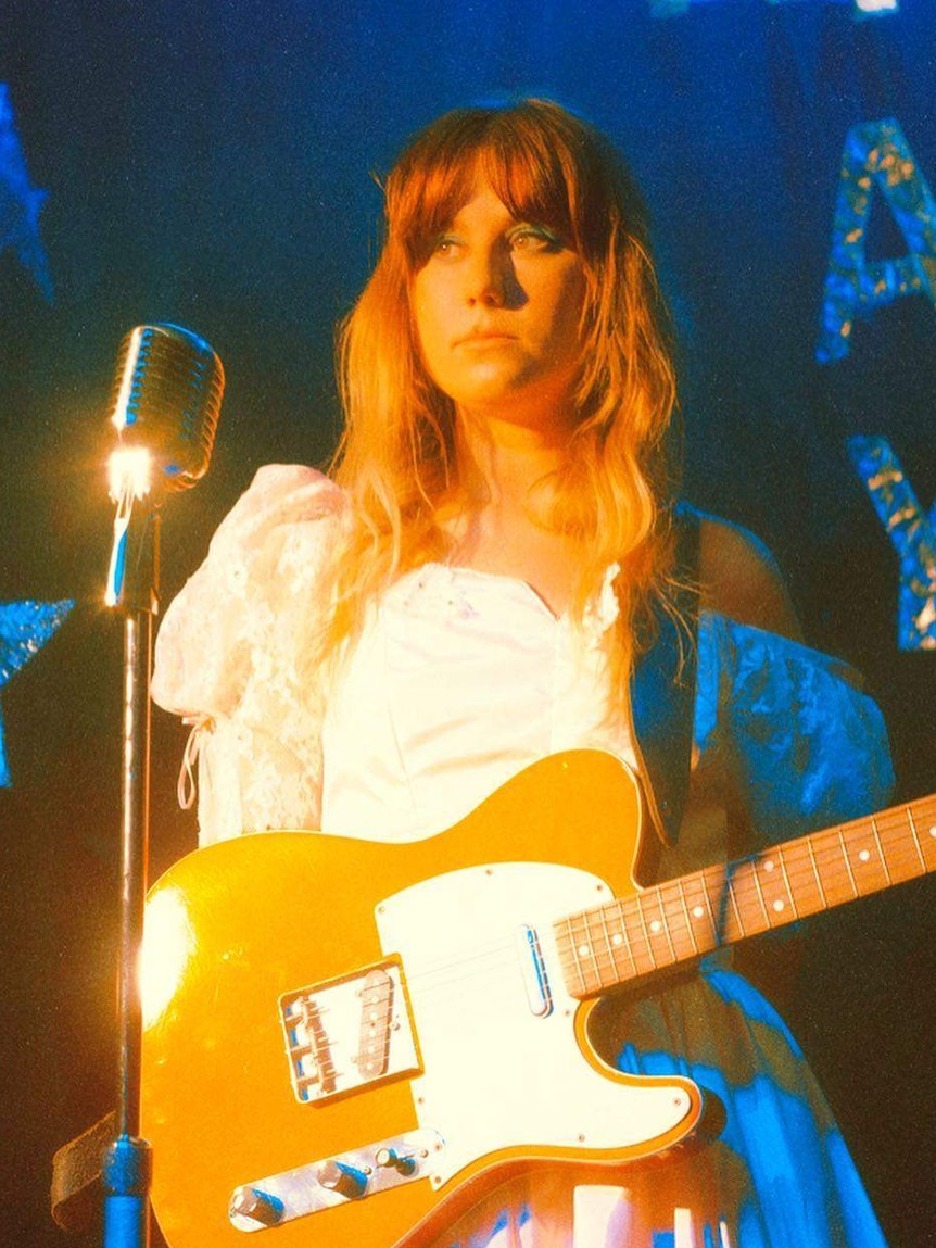 Tasmanian performer Maddy Jane with guitar.