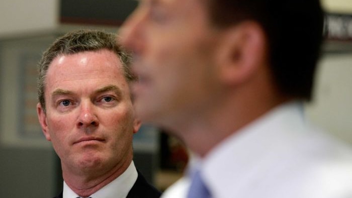 Education Minister Christopher Pyne in focus, PM Tony Abbott out of focus