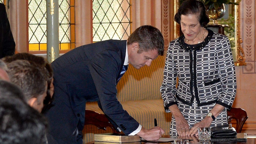 NSW Premier Mike Baird is officially sworn-in by Governor Marie Bashir at Government House in Sydney.
