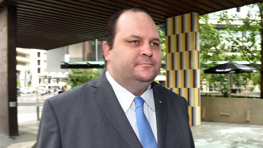 Scott Driscoll walks into Brisbane's Magistrates Court.