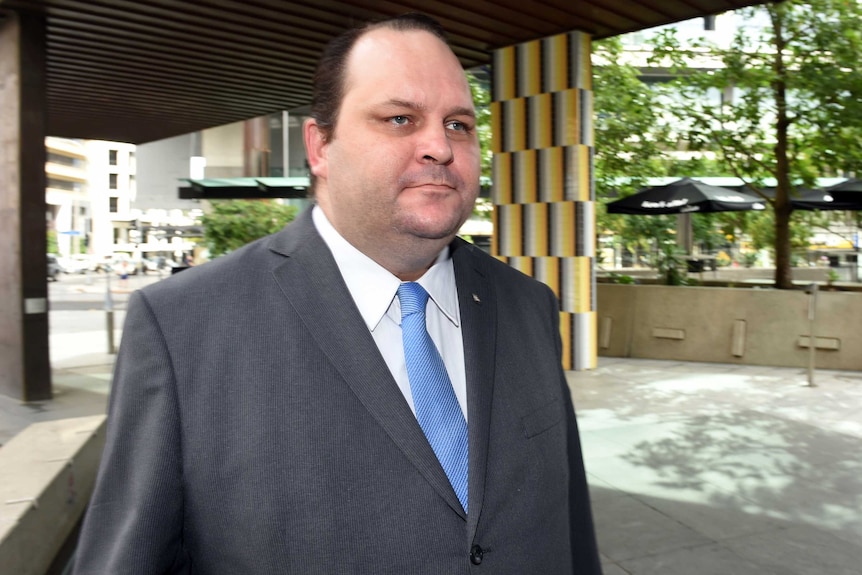 Scott Driscoll walks into Brisbane's Magistrates Court.