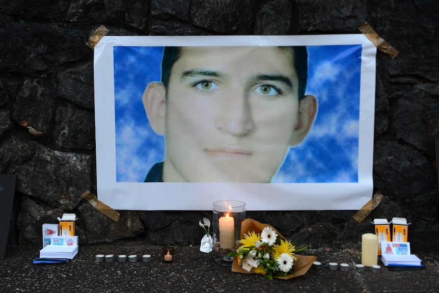 A shrine for Reza Barati is seen during a candlelight vigil in support of asylum seekers in Brisbane.