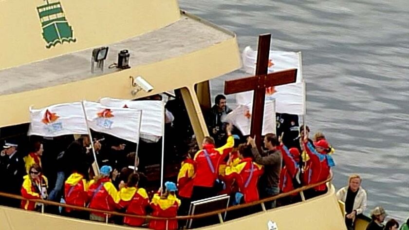 The World Youth Day cross makes its way across Sydney Harbour.