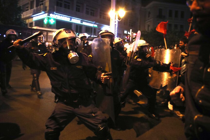 Police and demonstrators clash during a protest.