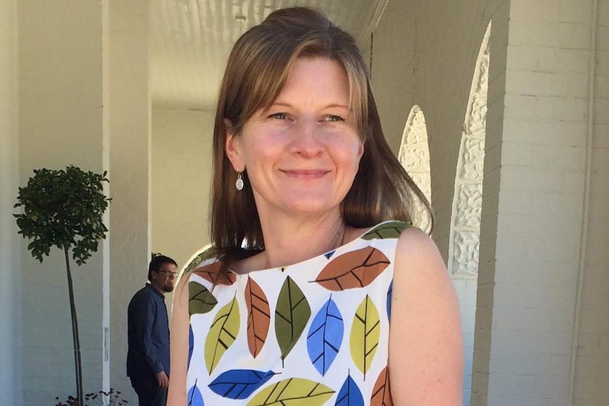 Cindy Waldron in a colourful leaf-patterned dress