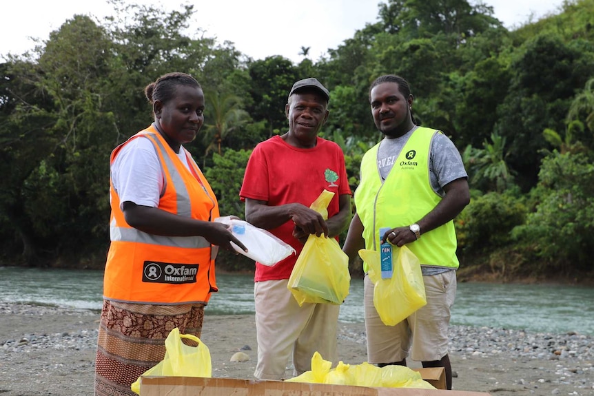 Jonah Hauosi with Oxfam staff