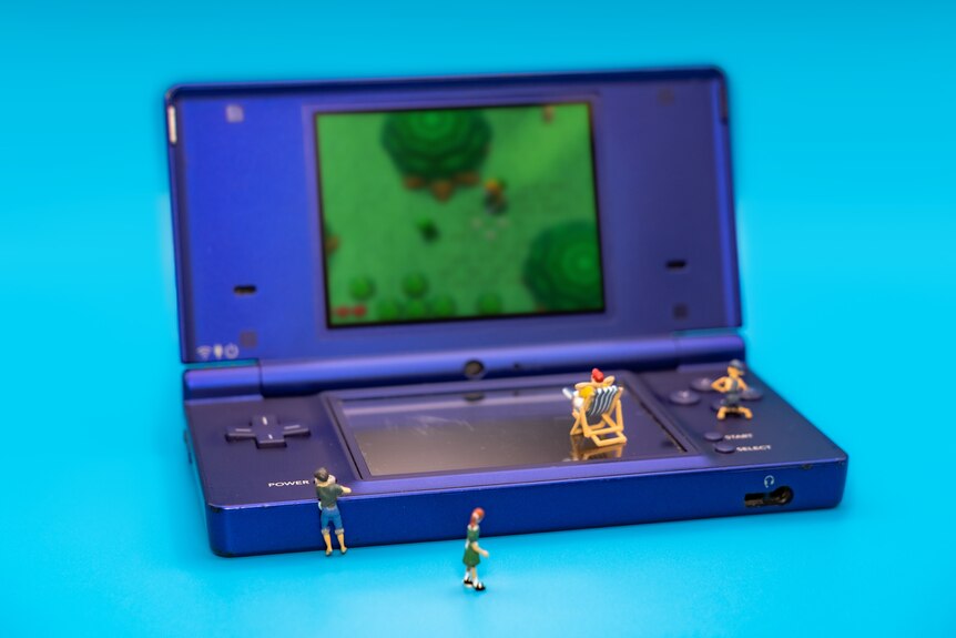 A photo of miniature people on a Nintendo.