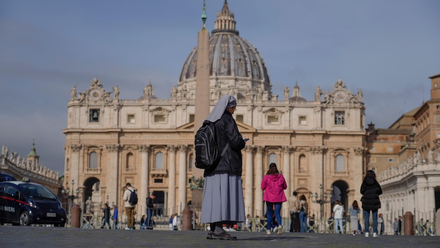 A nun standing in front of St Peter's Square in the Vatican