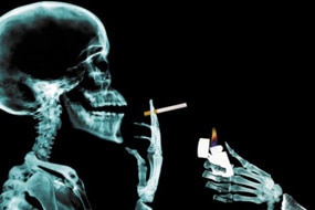 Skeleton getting cigarette lit (Thinkstock: Photodisc)