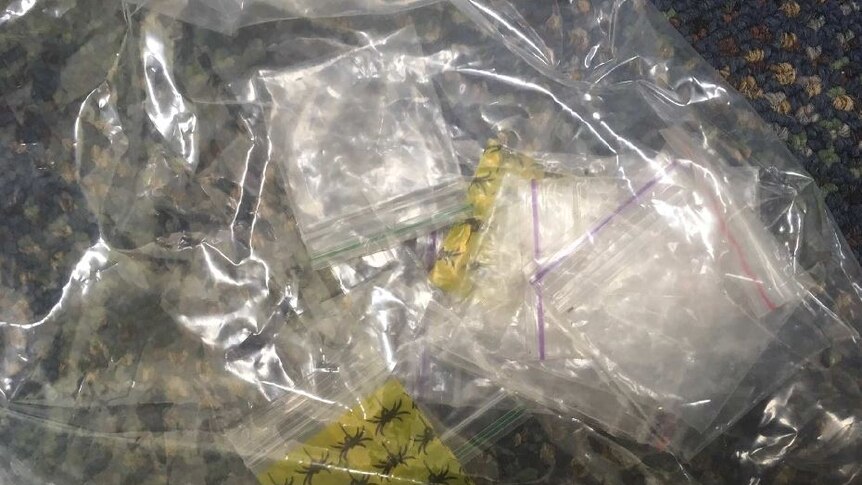 Small packages of drugs and electronics seized by police during the operation in St George and surrounding towns.